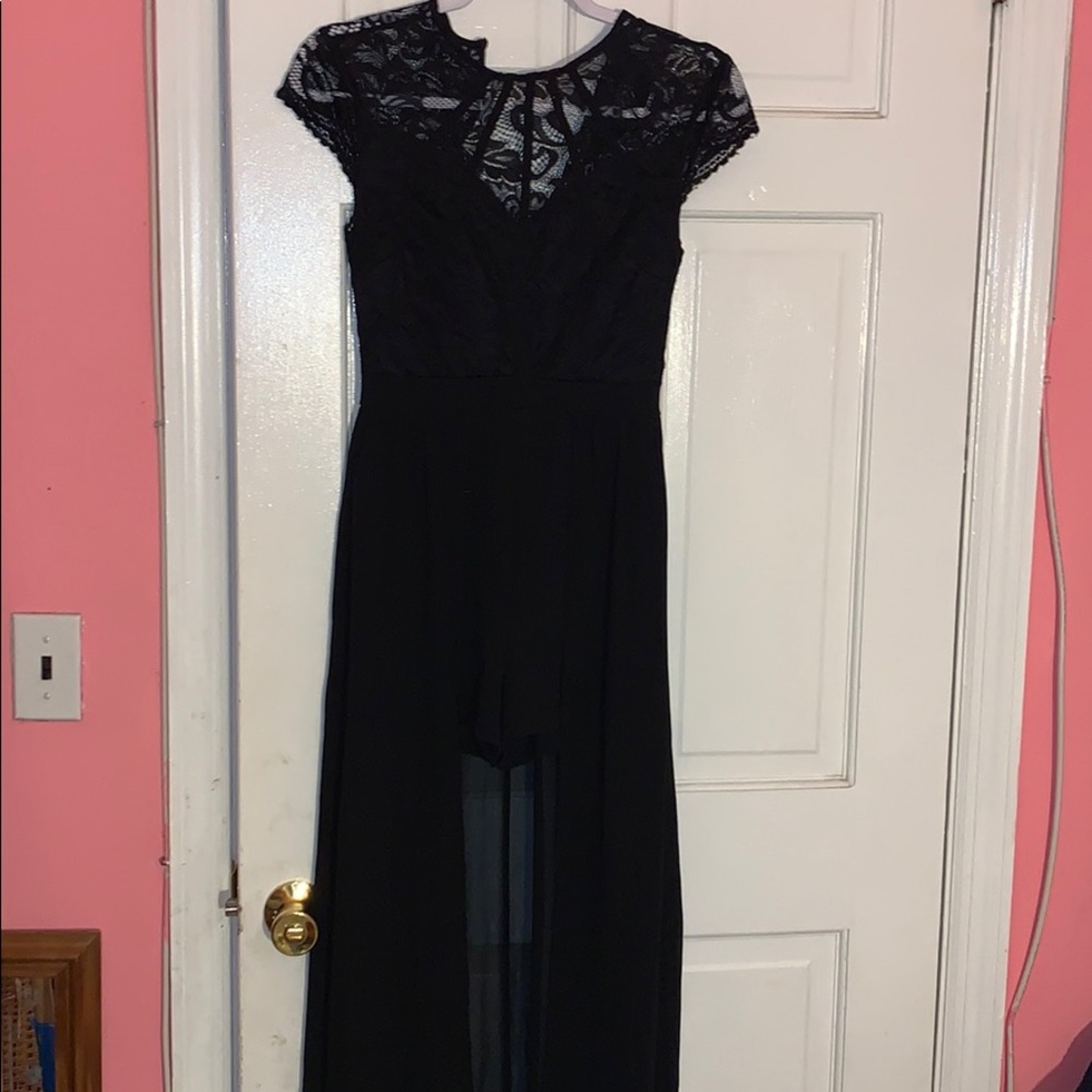 Black lace dress has shorts with long tale